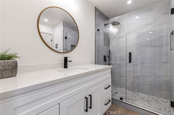 Bathroom, Glass Shower, Interior, Marble Walls, Recessed Lighting, Wood Texture Flooring