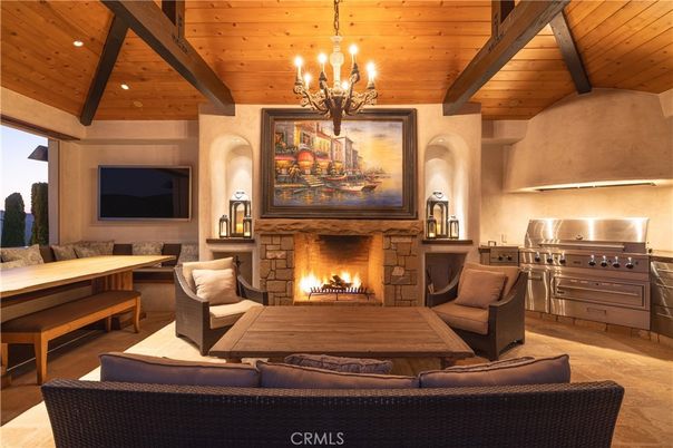 Chandelier, Fireplace, Interior, Living room, Recessed Lighting, Stainless Steel Appliances, Wooden Beams, Wooden Ceilings