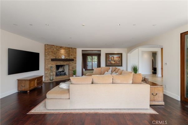 Fireplace, Interior, Living room, Recessed Lighting, Stone Walls, Wood Texture Flooring