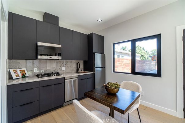 Dining room, Interior, Kitchen, Marble Walls, Recessed Lighting, Stainless Steel Appliances, Wood Texture Flooring
