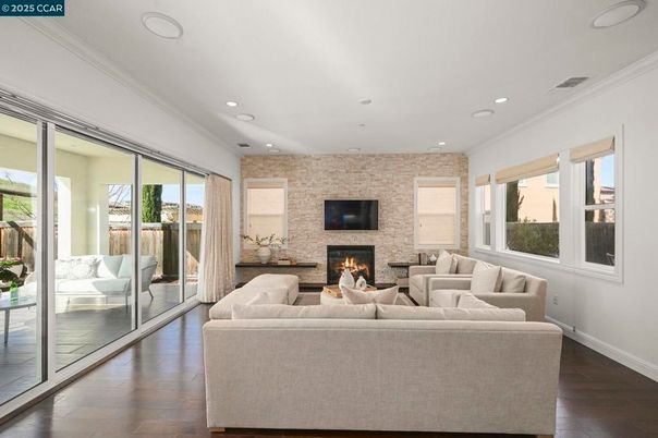 Fireplace, Interior, Living room, Recessed Lighting, Stone Walls, Wood Texture Flooring