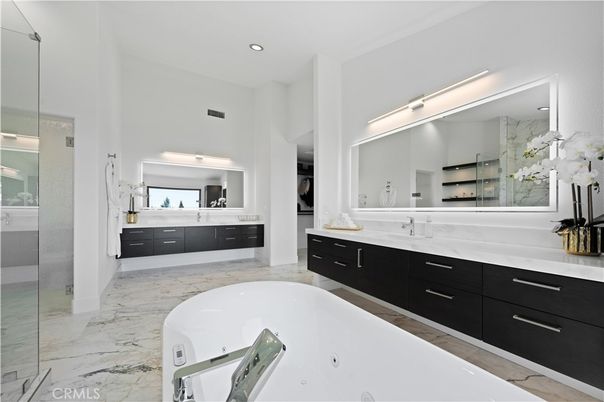 Bathroom, Dual Sink Vanities, Glass Shower, Interior, Marble, Marble Walls, Recessed Lighting