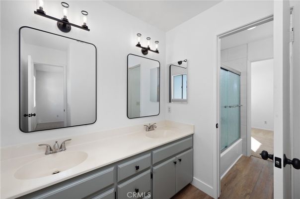 Bathroom, Dual Sink Vanities, Glass Shower, Interior, Wood Texture Flooring