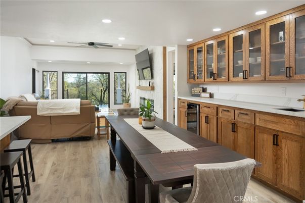 Dining room, Interior, Kitchen, Living room, Recessed Lighting, Stainless Steel Appliances, Wood Texture Flooring