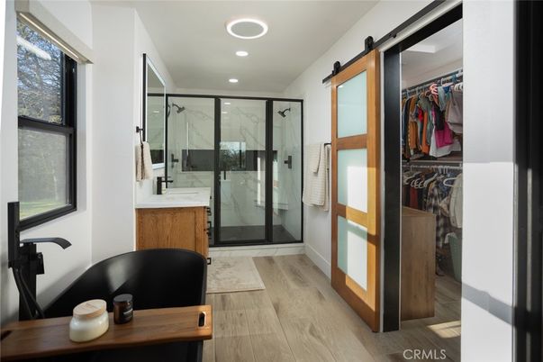 Bathroom, Glass Shower, Interior, Marble Walls, Recessed Lighting, Walk-in Closets, Wood Texture Flooring