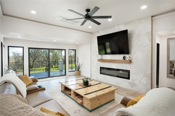 Fireplace, Interior, Living room, Recessed Lighting, Stone Walls, Wood Texture Flooring