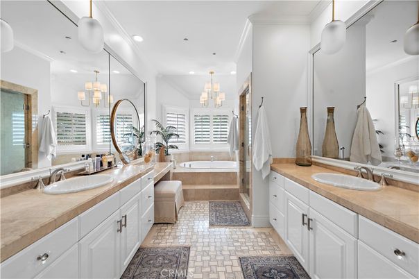 Bathroom, Chandelier, Dual Sink Vanities, Interior, Pendant Lights, Recessed Lighting, Tile Countertops