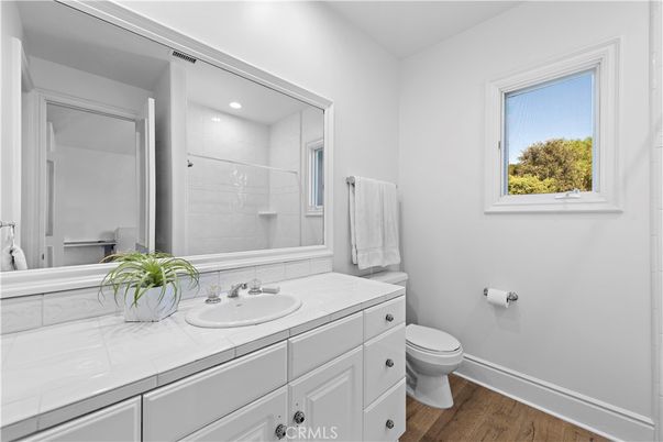 Bathroom, Interior, Recessed Lighting, Tile Countertops, Wood Texture Flooring