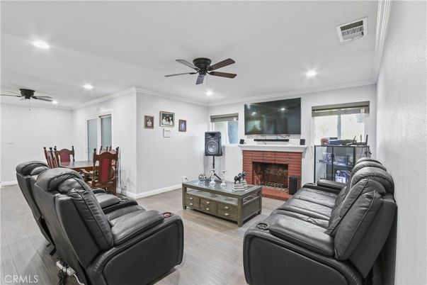Home Theatre Room, Dining room, Fireplace, Interior, Living room, Recessed Lighting, Wood Texture Flooring