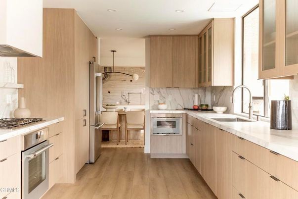Interior, Kitchen, Marble Walls, Recessed Lighting, Stainless Steel Appliances, Wood Texture Flooring