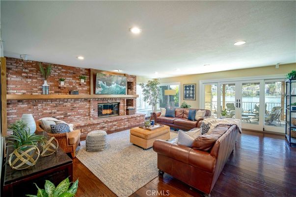 Fireplace, Interior, Living room, Recessed Lighting, Stone Walls, Wood Texture Flooring