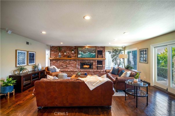 Fireplace, Interior, Living room, Recessed Lighting, Stone Walls, Wood Texture Flooring