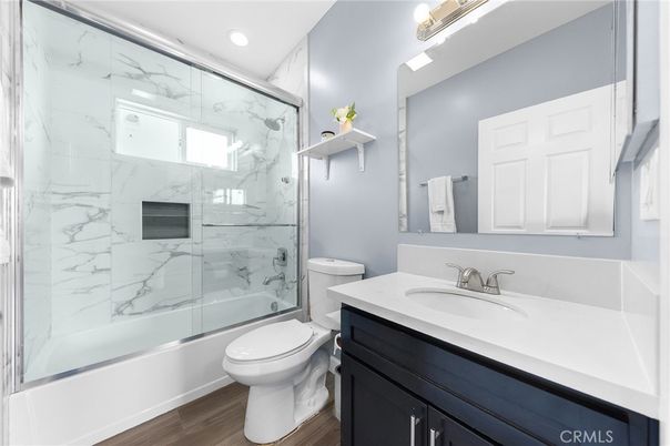 Bathroom, Glass Shower, Interior, Marble Walls, Recessed Lighting, Wood Texture Flooring