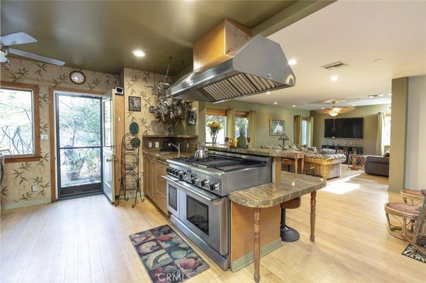 Dining room, Interior, Kitchen, Living room, Recessed Lighting, Stainless Steel Appliances, Wood Texture Flooring