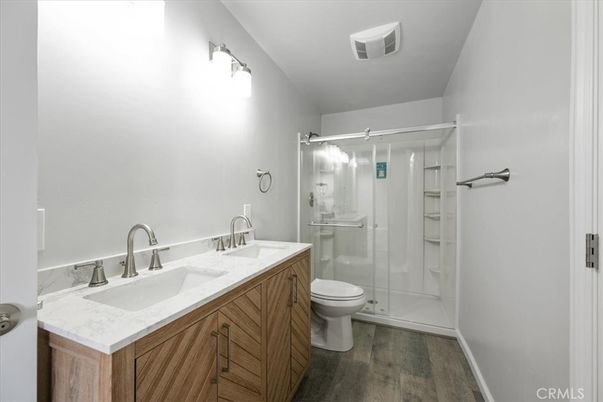 Bathroom, Dual Sink Vanities, Glass Shower, Interior, Wood Texture Flooring