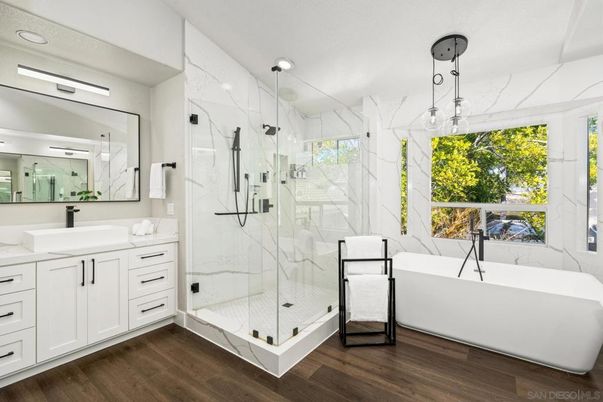 Bathroom, Free Standing Baths, Glass Shower, Interior, Marble Walls, Recessed Lighting, Wood Texture Flooring