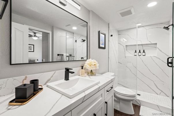 Bathroom, Glass Shower, Interior, Marble Walls, Recessed Lighting, Tile Countertops