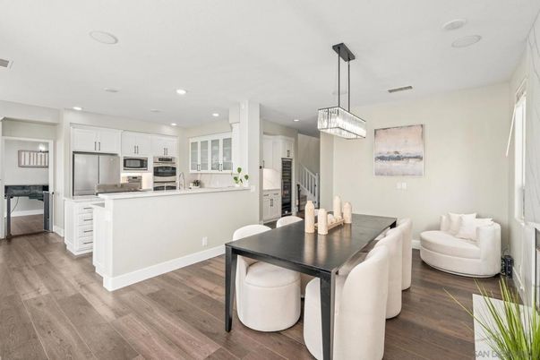 Chandelier, Dining room, Interior, Kitchen, Pendant Lights, Recessed Lighting, Stainless Steel Appliances, Wood Texture Flooring