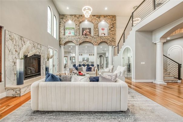 Fireplace, Interior, Living room, Recessed Lighting, Stone Walls, Wood Texture Flooring