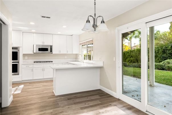 Interior, Kitchen, Pendant Lights, Recessed Lighting, Stainless Steel Appliances, Wood Texture Flooring