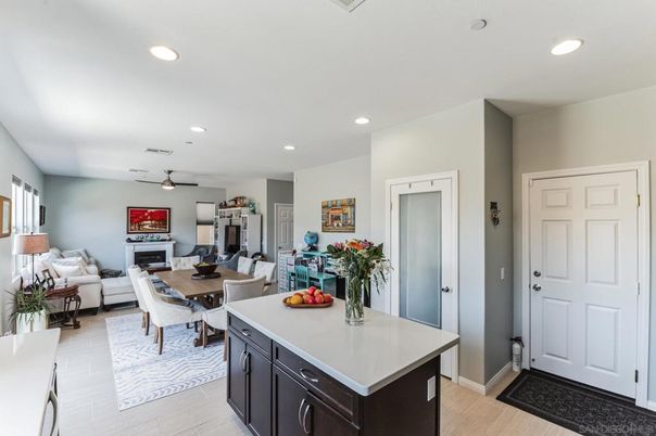 Dining room, Fireplace, Interior, Living room, Recessed Lighting, Wood Texture Flooring