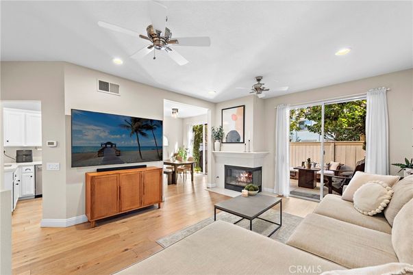 Dining room, Fireplace, Interior, Living room, Recessed Lighting, Wood Texture Flooring