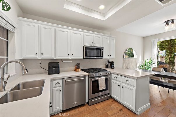 Dining room, Interior, Kitchen, Recessed Lighting, Stainless Steel Appliances, Wood Texture Flooring