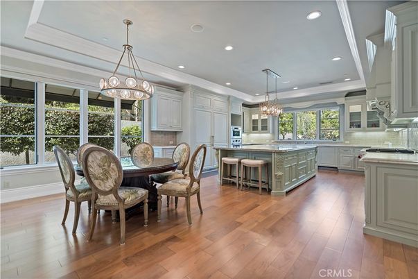 Chandelier, Dining room, Interior, Kitchen, Pendant Lights, Recessed Lighting, Stainless Steel Appliances, Wood Texture Flooring