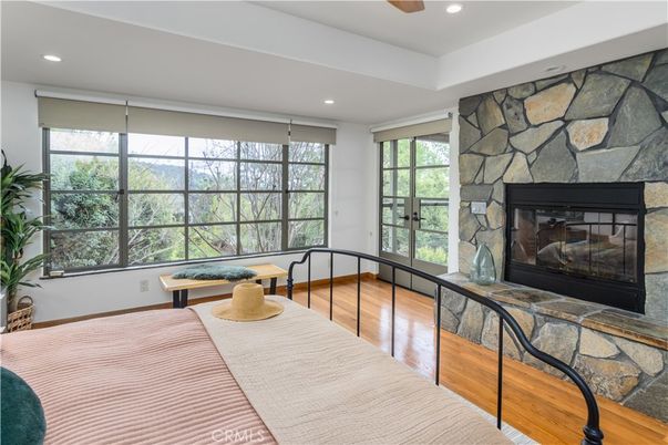 Bedroom, Fireplace, Interior, Recessed Lighting, Stone Walls, Wood Texture Flooring