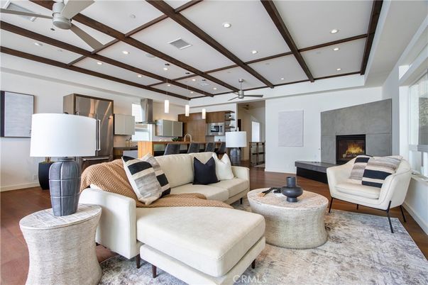 Fireplace, Interior, Kitchen, Living room, Pendant Lights, Recessed Lighting, Stainless Steel Appliances, Wood Texture Flooring