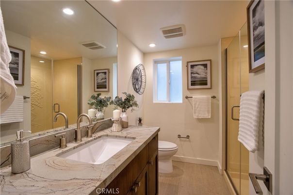 Bathroom, Dual Sink Vanities, Glass Shower, Interior, Recessed Lighting, Wood Texture Flooring