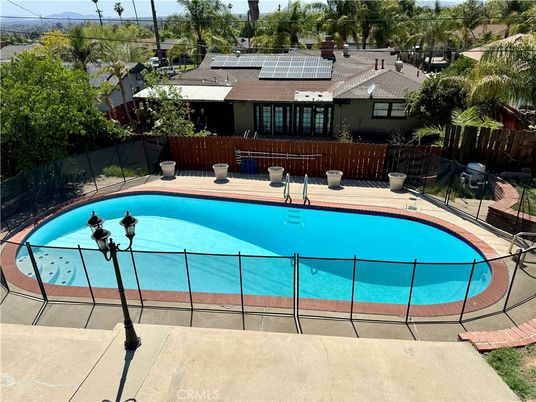 Exterior, Pool, Solar Panels