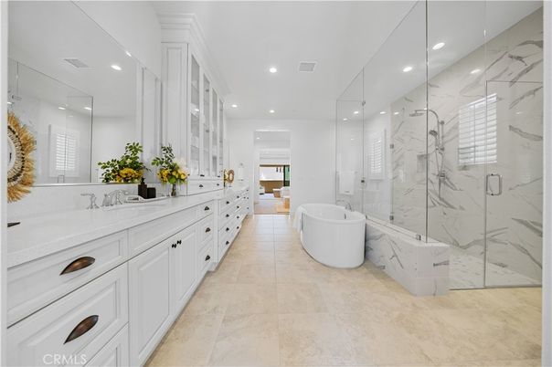 Bathroom, Dual Sink Vanities, Free Standing Baths, Glass Shower, Interior, Marble Walls, Recessed Lighting