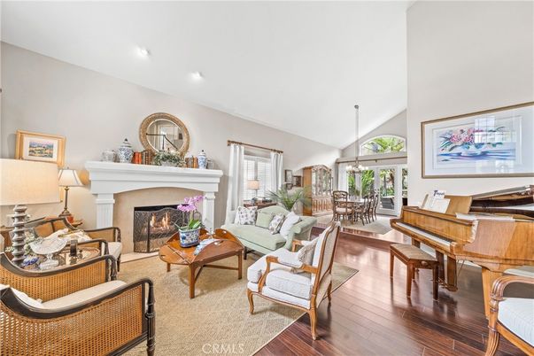 Chandelier, Dining room, Fireplace, Interior, Living room, Piano, Recessed Lighting, Wood Texture Flooring