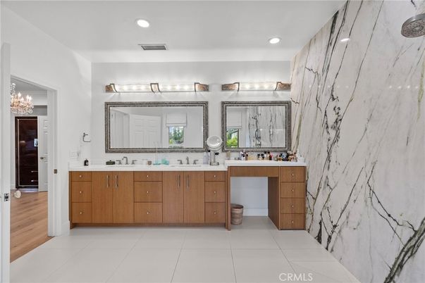 Bathroom, Dual Sink Vanities, Interior, Marble Walls, Recessed Lighting, Wood Texture Flooring