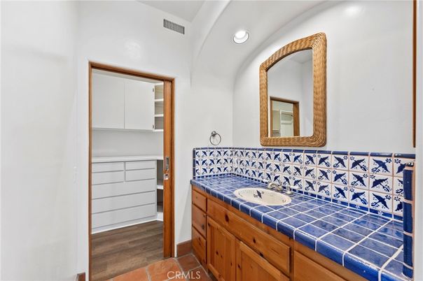 Bathroom, Dual Sink Vanities, Interior, Recessed Lighting, Tile Countertops, Wood Texture Flooring