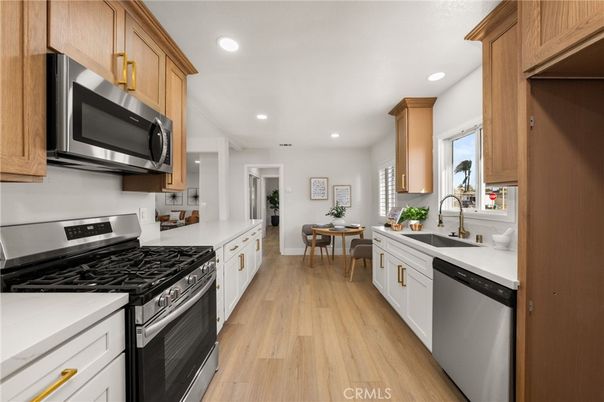 Dining room, Interior, Kitchen, Recessed Lighting, Stainless Steel Appliances, Wood Texture Flooring