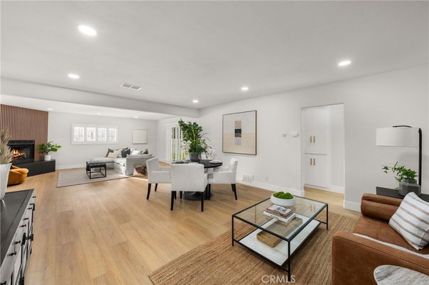 Dining room, Fireplace, Interior, Living room, Recessed Lighting, Wood Texture Flooring