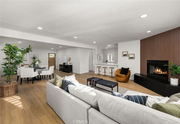 Dining room, Fireplace, Interior, Living room, Recessed Lighting, Wood Texture Flooring