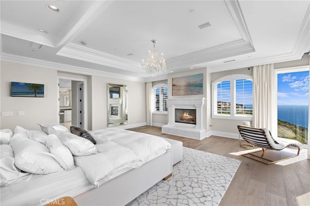 Bedroom, Chandelier, Fireplace, Interior, Recessed Lighting, Water, Wood Texture Flooring