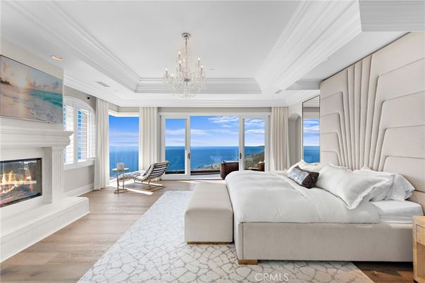 Bedroom, Chandelier, Fireplace, Interior, Recessed Lighting, Water, Wood Texture Flooring