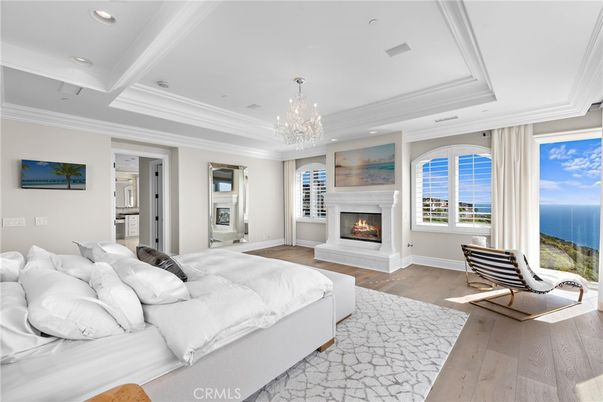 Bedroom, Chandelier, Fireplace, Interior, Recessed Lighting, Water, Wood Texture Flooring