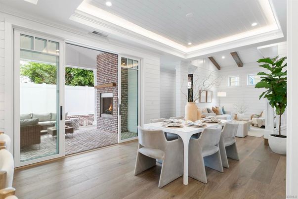 Dining room, Fireplace, Interior, Living room, Recessed Lighting, Stone Walls, Wood Texture Flooring