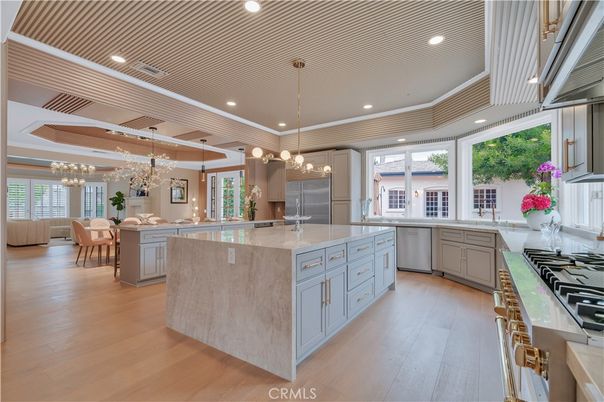 Chandelier, Dining room, Interior, Kitchen, Pendant Lights, Recessed Lighting, Stainless Steel Appliances, Wooden Ceilings, Wood Texture Flooring
