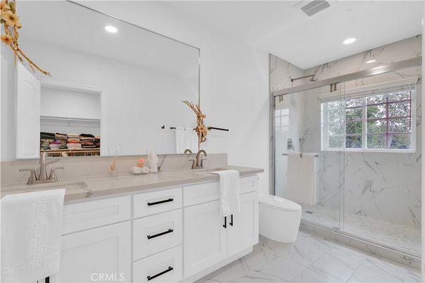 Bathroom, Dual Sink Vanities, Glass Shower, Interior, Marble, Marble Walls, Recessed Lighting