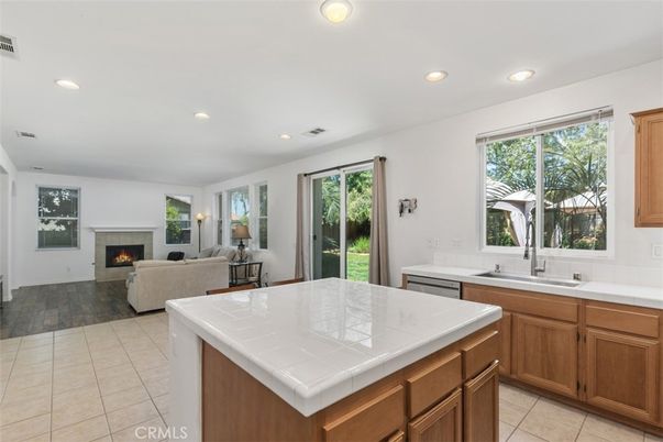 Fireplace, Interior, Kitchen, Living room, Recessed Lighting, Tile Countertops, Wood Texture Flooring