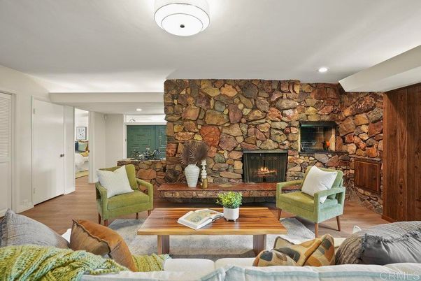 Fireplace, Interior, Living room, Recessed Lighting, Stone Walls, Wood Texture Flooring