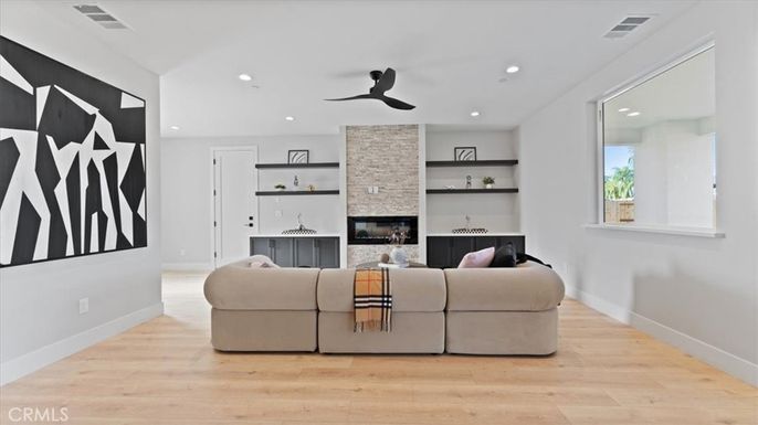 Fireplace, Interior, Living room, Recessed Lighting, Stone Walls, Wood Texture Flooring