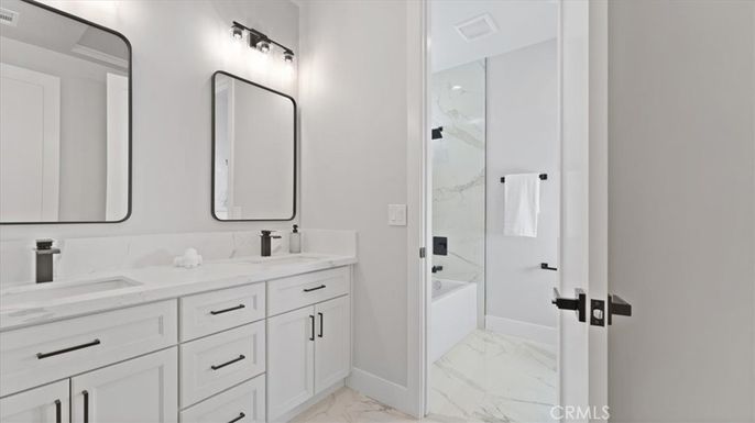 Bathroom, Dual Sink Vanities, Glass Shower, Interior, Marble, Marble Walls