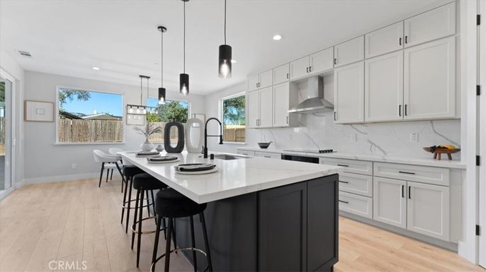 Interior, Kitchen, Marble Walls, Pendant Lights, Recessed Lighting, Stainless Steel Appliances, Wood Texture Flooring